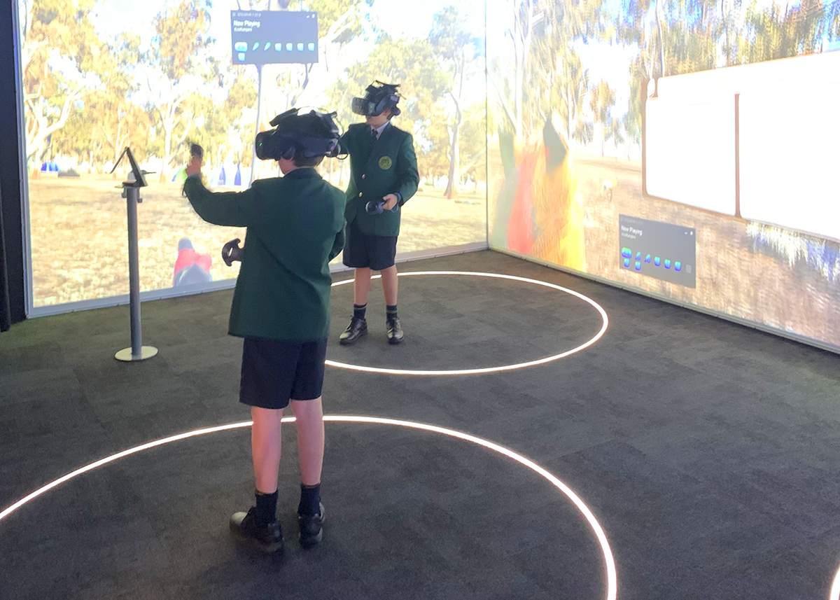 Students engaging in virtual reality learning with headsets and controllers at Mercedes College.